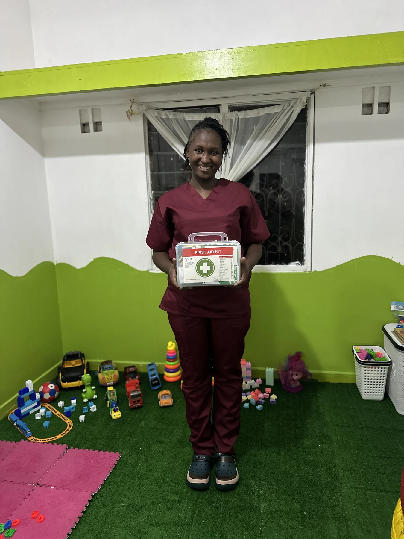 A Little Heaven staff member holding the centre's first aid kit